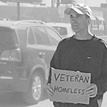 Picture of homeless guy holding sign