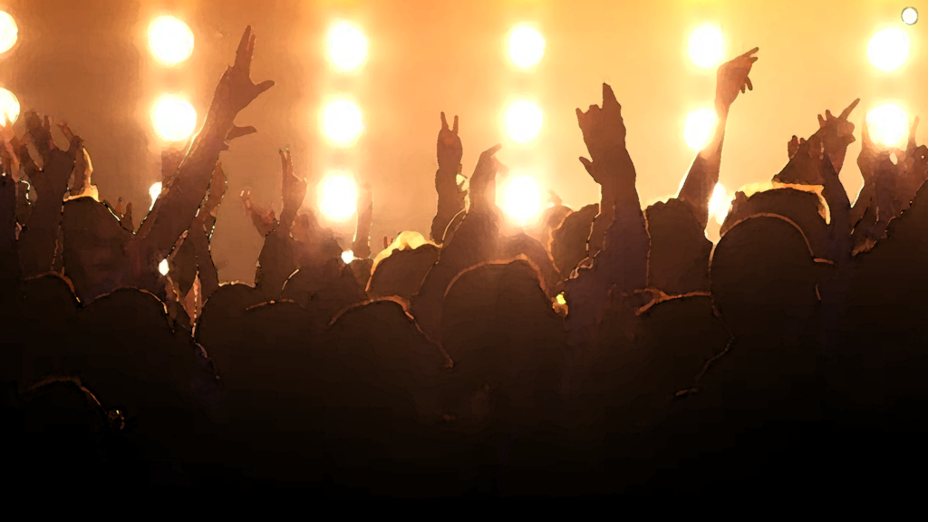 picture of people with hands up at a concert
